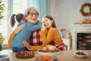 Life Assure Senior Woman Sitting In Chair And Laughing With Caregiver Nurse Blog